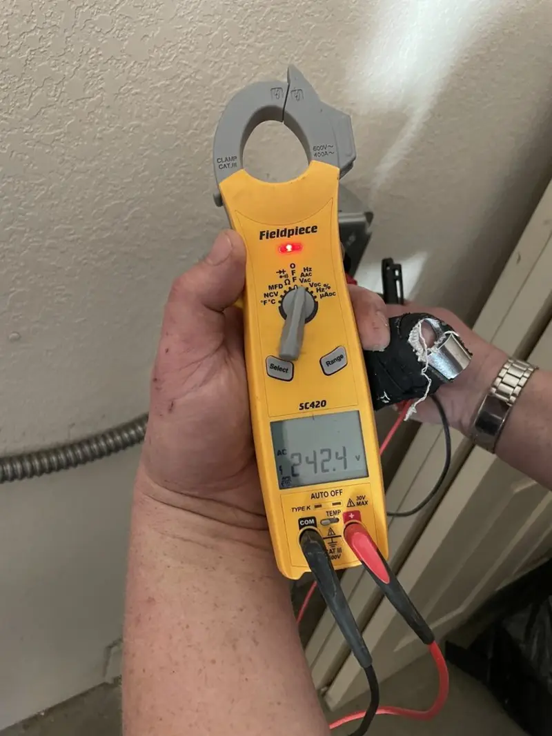 Voltage testing with clamp meter during Outlet Installation in Sunnyside